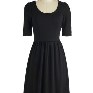 Black scoop neck and scoop back fit n flare dress